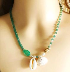 👉 May I introduce myself: My name is "Follow" 👈 Pearl necklace as a real eye-catcher. 💎 This beautiful necklace is lovingly made by hand for you. 💖 The pearl necklace has a cute little green glass fish and matching green emerald pearls. Simply cute! The freshwater pearls and shells complete the ocean look. Absolutely harmonious! 🌞 Great for a casual jeans look, leisure or business attire. You can wear the necklace as a single look or combine it with other necklaces. Materials: -Fish Glass - Green Bohemian Necklace With Pearl Charm, Bohemian Green Jewelry With Pearl Charm, Green Gemstone Beads Jewelry For Beach, Bohemian Green Necklace With Pearl Charm, Handmade Green Shell Necklace As Gift, Green Bohemian Pearl Necklace For Gift, Bohemian Green Shell Necklace As Gift, Bohemian Green Pearl Necklace As A Gift, Bohemian Green Pearl Necklace Gift