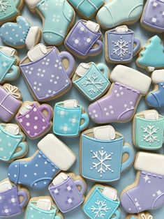 cookies decorated with blue, purple and white frosting