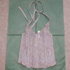 Brand New Corset Top In A Gray/Greige Color! Unlined But Has Boning For Structure. Back Has Hook And Eye Closures And Ribbon Ties At Neck. Size S. Victoria's Secret Lace Tops For Daywear, Ribbon Tie, Corset Top, Cute Tops, Women's Intimates, Victoria's Secret, Ribbon, Brand New, Grey