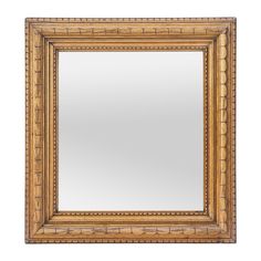 a wooden framed mirror on a white background