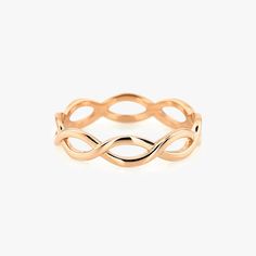 a gold ring with an intertwined design on the outside, and a thin band