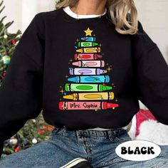 "Personalized Christmas Teacher Shirt, Teacher Crayon Christmas Tree Shirt, Retro Cute Teacher Christmas Sweatshirt, Teacher Christmas Gift ↓ Click here to view our additional fashionable collections ↓ https://handcraftedbyhelenn.etsy.com Product Details: - 100% Cotton (fiber content may vary for different colors) - Medium fabric (5.3 oz/yd2 (180 g/m2)) - Classic fit - Tear away label - Runs true to size Care instructions: - Machine wash: warm (max 40C or 105F); - Non-chlorine: bleach as needed; Personalized Teacher Christmas Gifts, Christmad Teacher Shirts, Teacher Christmas Sweatshirt, Teacher Christmas Sweater, Cute Christmas Teacher Gifts, Christmas T-shirts, Teacher Christmas Outfit, Christmas Teacher Shirts, Teacher Christmas Shirts