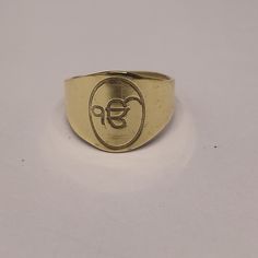 About item Item :-  Sikh onkar ring Ring size :- Chose from variation (Custom size accepted) Material  :- 925 Sterling silver Purity  :- 92.5 Title:- Ek Onkar Ring, handmade gold plated, Punjabi Sikh Khalsa Gurmukhi script, Punjabi Wedding Gifts, Khanda Symbol, Ek Onkar, Sikhism, Sikh Gift Description:- We use 925 sterling silver to making jewelry. We accept all types of custom & personalized order. Please send us a message if you are interested in a custom creation. Shipping profile:- We ship a Gold Rings For Ceremonial And Festive Occasions, Gold Rings As Diwali Gifts, Symbolic Yellow Gold Jewelry For Puja, Gold Rings For Diwali Gift, Traditional Brass Jewelry For Anniversary, Spiritual Gold Etched Rings, Spiritual Etched Gold Rings, Traditional 14k Stamped Ceremonial Jewelry, Gold Rings For Puja And Festivals