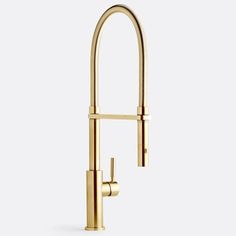 a gold faucet with the handles extended to it's side, in front of a white background