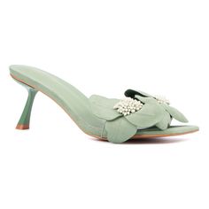 Make a statement with the Sierra heel slide, your standout piece this season. Featuring a slanted heel and oversized suede floral design adorned with bold beads, this heel is a true showstopper. Perfect for adding a touch of glamour to any outfit, the Sierra ensures you stand out with its unique and eye-catching style. Pastel Green Shoes, Fall Heel, Fall Heels, Green Heels, Kitten Heel Pumps, Open Toe Shoes, Pointed Toe Heels, Shoes Heels Pumps, Green Shoes