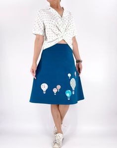 This playful and versatile skirt is designed with whimsical hot air balloon sew-on appliques that add a touch of charm and adventure to your outfit. Made with stretchy fabric, this plus-size skirt offers a comfortable and flattering fit for all-day wear. The fold-over waistband adds an extra element of comfort and flexibility, allowing you to adjust the fit to your liking. Whether you're strolling through the city or attending a casual gathering, this skirt is perfect for adding a pop of fun and Skirts Hot, Jersey Knit Skirt, Hot Air Balloon Decorations, Elastic Waistband Skirt, Stretchy Skirt, Jersey Skirt, Stretch Skirt, Plus Size Skirts, Beautiful Skirts