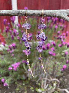 "One of my favorite flowers is the hanging wisteria. Their color is somewhere in the area of light lavender to deep purple, making amethyst a perfect gemstone choice to mimic it! These earrings are made with both Brazilian lavender amethyst and African dark purple amethyst, with faceted rondelles and step-cut gems in a cascade down 14K gold-filled chain. If you prefer sterling silver or 14K rose gold-filled, simply select in the drop-down menu! These are 3.25\" long, and will be gift-boxed at pu Lavender Earrings With Natural Stones For Gift, Purple Briolette Earrings For Wedding, Purple Briolette Amethyst Jewelry, Purple Amethyst Briolette Jewelry, Purple Natural Stone Drop Earrings, Lavender Briolette Gemstone Earrings, Purple Amethyst Earrings For Wedding, Purple Bohemian Crystal Earrings As A Gift, Purple Bohemian Crystal Earrings For Gift