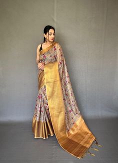 Description:   Embrace tradition with our Pattu Kalamkari saree, featuring a stunning brocade blouse and a contrast pallu adorned with intricate jari weaving.   Experience the luxury of smooth silk, beautifully enhanced by exquisite Kalamkari prints and embossed jari detailing.   The saree boasts a woven border, complemented by a stylish contrast blouse and pallu.   Stunning Kalamkari digital print adds a modern touch to timeless elegance.   Fabrics that speak to your soul   Hurry, book yours today! Luxury Multicolor Kalamkari Print Sets, Navratri Meenakari Tussar Silk Pre-draped Saree, Festive Tussar Silk Pre-draped Saree With Printed Border, Gold Pre-draped Jamawar Saree With Zari Work, Designer Tussar Silk Pre-draped Saree With Printed Border, Gold Pre-draped Saree With Cutdana In Jamawar, Art Silk Saree With Kalamkari Print In Traditional Drape, Art Silk Saree With Kalamkari Print, Semi-stitched Blouse Piece With Printed Border In Banarasi Silk