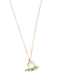 a gold necklace with the letter q on it