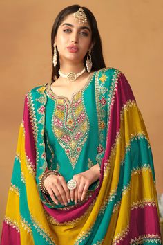 Make a stylish statement with this Chinon Silk Salwar Suit. The intricate embroidery adds elegance, while the vibrant multi-color dupatta adds a playful touch. Perfect for functions where you want to stand out with sophistication. Multi Color Dupatta, Silk Salwar Suit, Pakistani Suits Online, Embroidery Boutique, Sea Green Color, Turquoise Top, Zari Embroidery, Party Wear Gown, Embroidered Chiffon