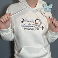 Stay toasty warm in style this season with our It's So Cold I Saw A Snowman Drinking Coffee Embroidered Crewneck Sweatshirt! Embroidered with a playful winter scene, this soft, cozy sweatshirt will be your favorite go-to for those chilly winter days. Get yours today! This crewneck is unisex. This is a physical product. Crewneck is embroidered. Rhinestone Hoodie, Winter Szenen, Nurse Hat, Embroidered Crewneck, Drinking Coffee, Easter Outfit, Winter Scene, Thanksgiving Outfit, Winter Days