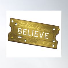 there is a sign that says believe on the front and back of it, in gold