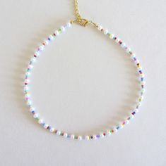 Colorful Pearl 4 mm Beaded Necklace, Beaded Necklace, Pearl  Necklace, Seed Bead Jewelry, Gifts for Her/Him, Beaded Choker, Glass pearls Beautiful necklace made of white glass pearls beads ( size 4 mm ), multicolore seed beads size 10/0. Measure the length of your neck with a measuring tape or you can use any thread, rope, or cable for telephone and after apply the measurements to a regular ruler. Choker is 13 inches with a 2 inches adjustable extender chain. 15 inches full length. White Beaded Necklaces With Colorful Beads, White 8mm Beads For Jewelry Making, Diy Necklace Pearl, Seed Bead Necklace Ideas, Summer Jewelry Diy, Seed Bead Necklaces, Kalung Manik-manik, Seed Beads Necklace, Seed Bead Bracelet Patterns