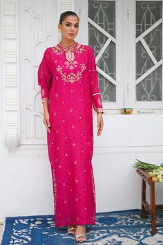 A hot pink cotton net kaftan adorned with golden embellishments and accentuated with puffed sleeves. This ethereal and airy ensemble is ideal for a festive look. Traditional Drape Kaftan With Gota Work For Parties, Party Kaftan With Gota Work And Traditional Drape, Traditional Embellished Kaftan For Festive Occasions, Anarkali Style Gota Work Kaftan For Festive Occasions, Wedding Kaftan With Gota Work For Festivals, Wedding Kaftan With Gota Work For Festive Occasions, Festive Wedding Kaftan With Gota Work, Festive Kaftan With Gota Work, Festive Embellished Straight Kurta Dress