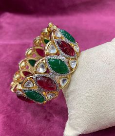 "Chic Indo Western Openable Fusion Navratan Multicolor (Red Green) Kada Bangle in hand carved stones, cubic zirconia on brass base metal & Gold Platting. Moissanite Kundan & Cubic Zirconia Fusion Bangle Pair. Very Beautiful in person. Perfect party wear on any Indian Attire. 😍Premium Quality as always. 💥Platting & Polish Guarantee. WHAT GOES IN 👉🏻Premium Quality Kundan, hand carved Stone & CZ Bangles / kada on brass base metal with gold platting and finishing. 👉🏻 Size 2.6\" Cz Bangles, Hand Carved Stone, Carved Stone, Gold Necklace Set, Kundan Necklaces, Indian Attire, Indo Western, Western Jewelry, Diamond Bangle