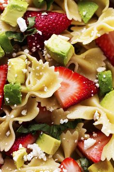 pasta salad with strawberries, avocado and fettuccine on top