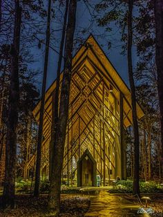 A glass wedding chapel lit up in warm gold lights at night Garvan Woodland Gardens, Garden Chapel, Woodland Gardens