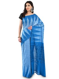 Presenting this elegant and classy Saree exclusively from Craftnirmit. Made from luxurious fine cotton, the sari is woven within the traditional Ikat Orissa weavers by hand that give the exotic look to saree. And this saree comes with geometric Pattern. It is furthered designed with a contrast striped Pallu and temple border that give the vibrant and classic traditional look. Feel stunning & styles in this traditional ikat saree from Craftnirmit. This saree you can be paired with an elegant pair Transitional Season Tussar Silk Saree With Ikat Print, Transitional Tussar Silk Saree With Ikat Print, Traditional Blue Cotton Pre-draped Saree, Transitional Season Handloom Cotton Silk Pre-draped Saree, Cotton Silk Saree With Woven Motifs, Cotton Saree With Woven Motifs In Blue, Cotton Saree With Woven Motifs, Blue Ikat Print Saree, Blue Cotton Pre-draped Saree