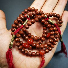 ❤ This old mala was collceted from Gerze Tibet.It's composed of 108 Indian jujube beads ,agate beads,and 1 pair of brass bead counters.❤Details:Mala'perimeter is 70cm,28 inches.Handmade 108 beads approximately 7mm,0.28 inch.1 round agate bead 10mm / 0.4 inch.2 oval agate beads 8mm / 0.3 inch.1 agate guru bead 8mm / 0.3 inch.1 pair of brass bead counters: 3mm ❤ Great Mala For Meditation and Yoga Practitioners❤ Good karma beads that protect one from negative energy and removes obstacles.❤Malas are Healing Wooden Beads Jewelry For Festivals, Spiritual Wooden Beaded Necklaces For Festivals, Gold Mala With 108 Beads For Healing, Gold Healing Mala With 108 Beads, Spiritual Polished Brown Beads, Spiritual Brown Polished Beads, Bohemian Mala With 108 Round Beads, Bohemian 108 Beads Round Mala, Adjustable Agate Hand-strung Mala