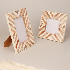 two wooden frames sitting next to each other