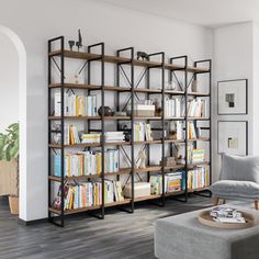 a living room filled with furniture and a book shelf next to a couch on top of a hard wood floor