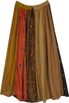 A traditional patchwork skirt in Mitti (earthen) shades, patched together and highlighted on the vertical panels by a thick bundled thread (dori) running from waist to hem to give a unique look.  This long skirt has an accordion pleat that starts smaller at the waist and gets larger towards the hem, this helps give a taller look. #tlb #Patchwork #MaxiSkirt #Peasant #Printed #bohemianfashion #Handmade #Doripatchworkskirt #HippiePatchworkSkirt #RecycledPatchworkSkirt Brown Patchwork Tiered Skirt, Bohemian Brown Patchwork Skirt, Traditional Long Brown Skirt, Moodboard Fillers, Chic Long Skirt, Skirt Patchwork, Traditional Patchwork, Mustard Skirt, Geeky Clothes