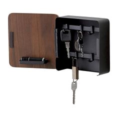 a wooden box with two keys in it and a key lock attached to the door