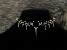 14, 16, or 18 inch total length (clasp + chain + o ring) helm choker! Features one large spike charm and 6 small spike charms. Chainmail and o ring are aluminum and stainless steel and charms are silver plated Clasp is stainless steel. *now comes with a 1 inch handmade stainless steel extension chain* 14 inch choker is adjustable up to 15 inches. 16 inch choker is adjustable up to 17 inches. 18 inch choker is adjustable up to 19 inches. Necklace is on a hand stamped/ hand drawn backing and come Handmade Punk Style Jewelry Choker, Handmade Punk-style Choker Jewelry, Handmade Punk Style Choker, Punk Style Handmade Choker Jewelry, Medieval Style Metal Jewelry For Fantasy Events, Adjustable Silver Fantasy Choker, Silver Fantasy Choker Adjustable, Nickel Free Punk Style Choker, Gothic Metal Jewelry For Fantasy Events