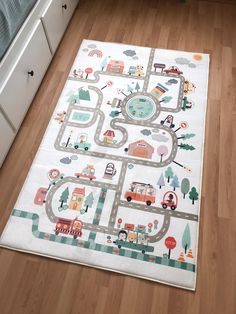 a child's rug with cars and trucks on it