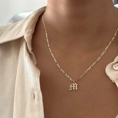 Elevate your style with our Everyday Old English Initial Necklace, featuring sparkling cubic zirconia details. This piece adds a touch of elegance and personalization to your daily look. Choose single or double letters—up to 2 letters only. Choose between 3 different types of chains and lengths. Important: Please select an Old English Initial Charm (+$12) to complete your purchase. Without the charm, you’ll receive just the chain. Why You'll Love It: Versatile Design: Perfect for wearing solo or Everyday Personalized Cubic Zirconia Necklaces, Elegant Jewelry With Letter Beads For Everyday, Elegant Everyday Nameplate Initial Necklace, Trendy Everyday Letter-shaped Jewelry, Elegant Initial Pendant Necklace With Letter Beads, Elegant Letter Beads Charm Necklace For Anniversary, Anniversary Letter Beads Name Necklace With Initial Pendant, Initials Cubic Zirconia Name Necklace For Gift, Cubic Zirconia Initial Pendant Name Necklace As Gift