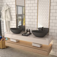 a bathroom with two sinks and a large mirror