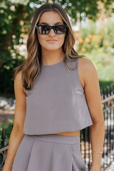 Whether you're dressing up for a night out or keeping it casual for daytime wear, this crop top is sure to elevate your overall look! The textured fabric adds visual interest and dimension to the top, while the cropped silhouette offers a modern and flattering fit. Pair it with high-waisted jeans, skirts, or shorts for a chic and trendy ensemble. Fitted Cropped Shirt For Day Out, Trendy Cropped Crop Top For Day Out, Cropped Hem Tops For Summer Day Out, Chic Fitted Tank Top With Cropped Hem, Chic Cropped Shirt With Cropped Hem For Spring, Chic Fitted Crop Top With Cropped Hem, Chic Cropped Hem Crop Top For Summer, Slightly Cropped Crop Top For Spring Day Out, Chic Slightly Cropped Tank Top For Summer