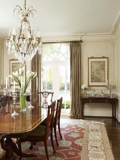 an image of a dining room with chandelier