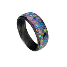 * THE RING - Carbon Fiber Ring with Nebula Opal inlay in a high gloss finish. This ring has a traditional rounded band, Nebula opal inlay, and a high gloss finish. The opal inlay is infused with glow powder and will glow an aqua color. Each ring is individually handcrafted giving you a one of a kind piece.  PRIMARY COLORS: Pink, Blue, Purple SECONDARY COLORS: Yellow, Green * SIZING- All of our rings are made according to US Sizing and are standard fit. Please keep in mind, the band width can aff Black Titanium Round Jewelry, Black Oval Opal Jewelry, Oval Black Opal Jewelry, Black Opal Round Jewelry, Black Titanium Jewelry With Polished Finish, Black Ring With Inlay, Black Rings With Inlay, Black Inlay Round Ring, Round Enamel Ring With Inlay