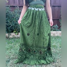 Green Embroidery Maxi Skirt, Perfect For Embracing Those Boho Hippie Vibes! This Stunning Skirt Features Pleated Boarder That Adds A Touch Of Elegance, While The Maxi Length Offers A Chic And Comfortable Fit.Crafted With Fairycore Fashion In Mind, This Skirt Is Ideal For Creating Enchanting Cottage Core Looks. Whether You're Strolling Along Sandy Shores Or Exploring Hideaways, This Skirt Will Ensure You're Dressed To Impress. Its Flowing Silhouette Captures The Essence Of Fairycore Aesthetics, E Summer Long Embroidered Skirt, Summer Embroidered Long Skirt, Embroidered Long Skirt For Summer, Long Cotton Skirt With Embroidered Hem, Long Embroidered Cotton Skirt, Summer Festival Skirt With Floral Embroidery, Flowy Cotton Skirt With Embroidery, Embroidered Flowy Cotton Skirt, Bohemian Flowy Skirt With Floral Embroidery