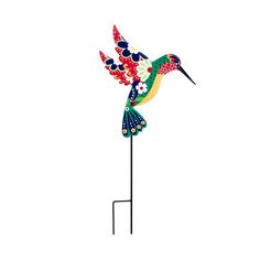 a colorful bird is standing on a black stand and has flowers painted on it's wings