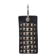 a black leather keychain with metal rivets