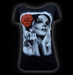 Make a bold statement with this women's dead queen tattoo sugar skull t-shirt. Show off your unique style with this one-of-a-kind tattoo fashion statement. Crafted from 100% cotton, this stylish t-shirt is sure to make a lasting impression. Get yours today and stand out from the crowd! This cool women's t-shirt features a stunning woman with sugar skull tattoos. It is a fun and casual shirt for any occasion.  Made in the usa Skull Queen, Punk Woman, Market Art, Queen Tee, Queen Tattoo, Black Shirts Women, Scoop Neck Tee, Skull Tshirt, Goth Outfits