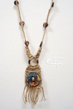 the necklace is adorned with beads and tassels