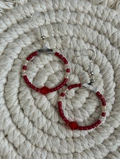 Miniature metallic  red and pearl round hoop dangle earrings with a metallic red bicone bead in the center. Made with multicolored glass seed beads attached to a hypoallergenic earring ring fixing. Red Hoop Earrings, Hypoallergenic Earrings, Ring Earrings, Seed Beads, Etsy Earrings, Dangle Drop Earrings, Hoop Earrings, Dangle Earrings, Miniatures