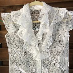 Gorgeous white lace romantic blouse. Lovely buttons! by Jürgen Michaelsen. Good vintage condition  Labelled size 38 Measurements (item lying flat on the ground, doubled for chest, waist and hips): Length on the back about 61 cm(  24.02 inches) Bust armpit to armpit  about  94 cm ( 37.01 inches) Waist about 86 cm (  33.86 inches) Arm from shoulder seam  cm (  inches) Shoulder width measured on the back about  cm (   inches) Bottom hem about 94 cm (  37.01 inches) Please note that the item is vintage and used! I always try to ship as fast as possible, processing the order normally takes up to 2 weeks , depending on my traveling schedule.  Please contact me if you have any questions about the item or shipping. Thank you for checking out my store! Vintage Cream Blouse With Lace Top, Vintage Lace Blouse With Ruffles, White Vintage Sleeveless Lace Top, Luxury White Lace Top With Ruffles, Vintage Lace Blouse With Ruffled Collar, Romantic Blouses, Romantic Lace, Blue Sweatshirt, Lace Ruffle