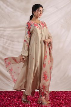 Ivory silk asymmetric kurta with side pockets, multi color placement floral print, sequin, bead and French knot thread embroidered highlights. Paired with palazzo with printed border.
Components: 2
Pattern: Printed and Hand Embroidered
Type Of Work: Bloom Print, Bead, Sequin and French Knot Thread Work
Neckline: V Neck
Sleeve Type: Puff Sleeves
Fabric: Silk
Color: Ivory
Other Details: 
Embroidered yoke
Curved hem
Side slits
Embroidered highlights
Model height: 5ft inches, wearing size S
Kurta Cl Knot Thread, Kurta With Palazzo, Kurta Palazzo Set, Beautiful Pakistani Dresses, Palazzo Set, Silk Kurta, Kurti Designs Party Wear, Kurta Designs Women, Trendy Fashion Tops