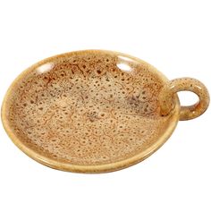 a brown ceramic dish with handles on a white background