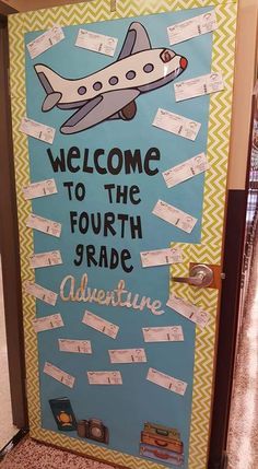 a bulletin board with some writing on it and an airplane in the sky above it