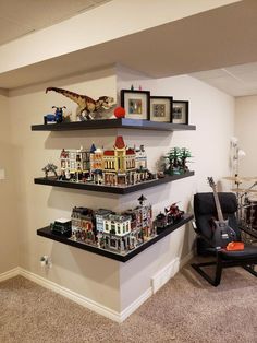 a living room with two shelves filled with legos