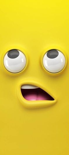 a close up of a yellow face with big eyes and an angry look on it's face