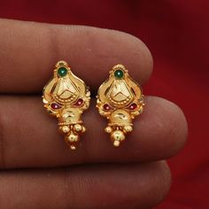 Beautiful yellow gold earrings Gold Purity- 22k yellow Gold Length - 2 cm Width - 1.3 cm Weight - 2.39 grams approx The earrings comes with artificial push If you want real gold push please let us know. Fusion Style Yellow Gold Earrings With Tilla, Gold Bollywood Jhumkas For Marriage, 22k Gold Meenakari Bridal Earrings For Wedding, 22k Gold Tilla Earrings For Wedding, Bollywood Style Gold Jhumkas For Marriage, Festive Intricate Design Earrings For Wedding, Temple Style Bridal Earrings With Intricate Design, Intricate Temple Jewelry Bridal Earrings, Gold Bridal Earrings For Marriage And Festivals