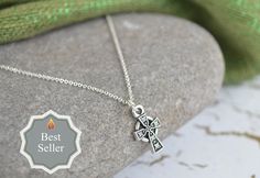 Just a simple, elegant touch of Celtic style in this Irish Celtic Cross Necklace. A perfect necklace for anyone, and especially those who love Ireland and want to wear a bit of Celtic history. Perfect for youth, or someone who prefers a smaller, petite, classic style. **Size: The cross itself is about 5/8 of an inch and almost hangs at 3/4 of an inch when on the jump ring attached to the chain. In millimeters, the cross is 15mm long and 9mm wide. Please see the second photo for a reference of th Celtic History, Baptism Necklace, Celtic Cross Necklace, Fire Jewelry, Love Ireland, Celtic Style, Irish Celtic, Celtic Cross, Celtic Jewelry