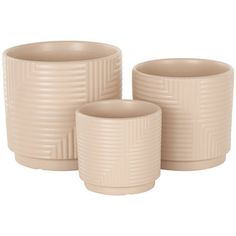 three beige vases sitting next to each other