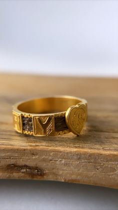 This is a beautiful antique mourning ring set in 18ct gold and dated from the Edwardian period. With woven hair covering the shank, interspersed with the letters MEMORY and a gold heart right in the centre with the initials A.P engraved on it. It's in very good condition with minor wear commensurate with age - there is some small engraving loss in the square of letter Y (as seen in photo). Crafted in solid 18ct gold, it has acquired a wonderful patina to it. Size: P/US7.5 (not resizable) Fully h Victorian Gold Engraved Etched Ring, Victorian Gold Etched Engraved Ring, Victorian Gold Engraved Promise Ring, Victorian Etched Gold Engraved Ring, Antique Gold Engraved Promise Ring, Yellow Gold Brass Engraved Ring For Promise, Victorian Gold Initial Ring For Anniversary, Handmade Antique Engraved Yellow Gold Ring, Victorian Gold Initial Ring As Gift